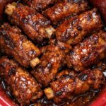 Pour pork and beans over ground beef, coupled with 3 ingredients, into slow cooker for a hearty dinner that’s always a yes in my house